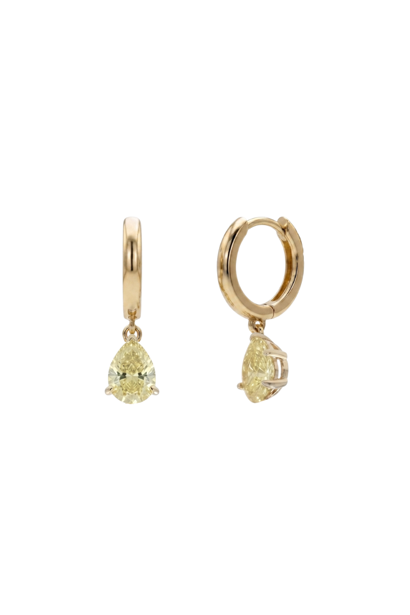 A pair of gold huggie hoop earrings with dangling pear-cut yellow gemstones, shown against a plain white background.